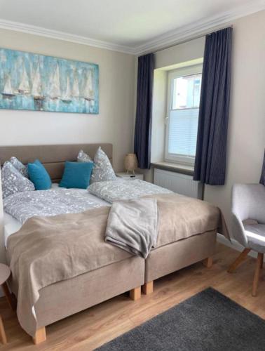Ένα ή περισσότερα κρεβάτια σε δωμάτιο στο Ostseestrand-Apartments