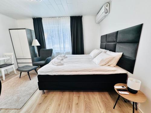 Postel nebo postele na pokoji v ubytování Katariina Apartments
