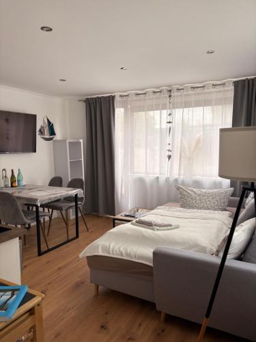 a living room with a bed and a couch at Ferienhaus bei Engel in Ahrensbök