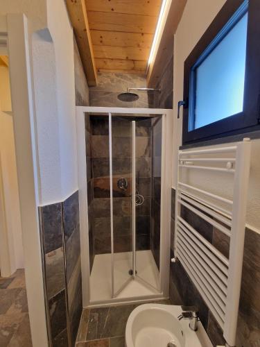 a bathroom with a shower and a toilet at Dimore d'Oltremare - Appartamento Libeccio in Lavagna