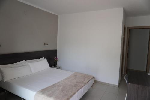 Hotel Ram Rooms Tahitiにあるベッド