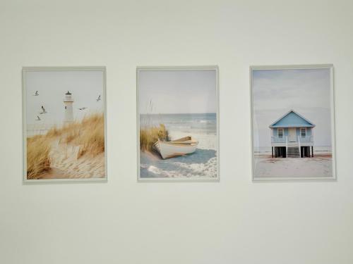 four pictures of a beach with a house and a boat at Nido di mare in San Benedetto del Tronto