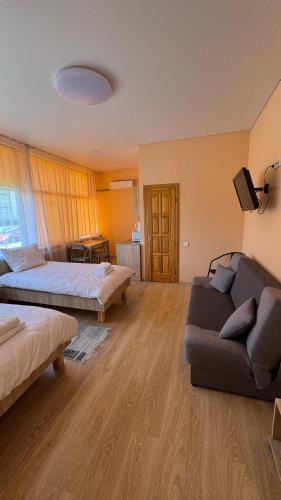 Ένα ή περισσότερα κρεβάτια σε δωμάτιο στο Apartamentai KAVA