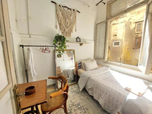 Postel nebo postele na pokoji v ubytování Arab Boutique I Alexandria I Downtown