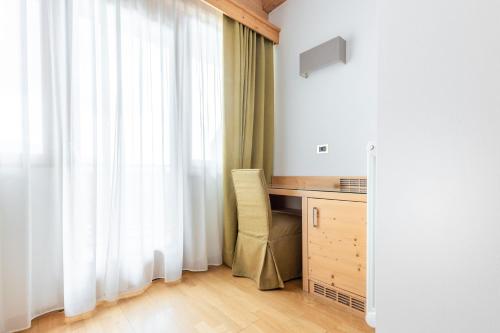Кровать или кровати в номере Hotel Bel Soggiorno
