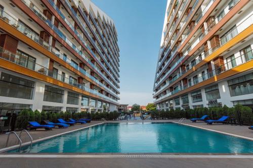 a swimming pool in the middle of a building at Bays Accra City Luxury Lodge at The Signature Apartments in Accra
