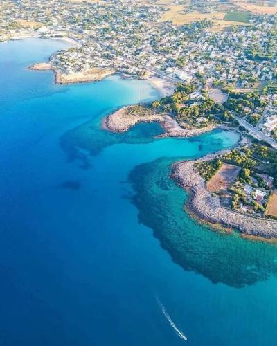 an aerial view of a group of islands in the water at Villa Cohiba - 700m dal mare in Pulsano