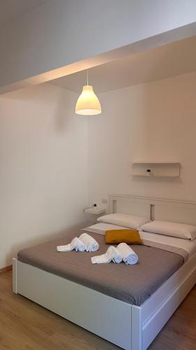 Postel nebo postele na pokoji v ubytování Peonia - Le Grotte Rooms And Apartments