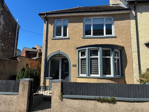 a brick house with a window and a fence at Modern and comfortable stay in Morecambe in Morecambe