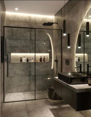 a bathroom with a sink and a bath tub at Llanesmar in Posada de Llanes