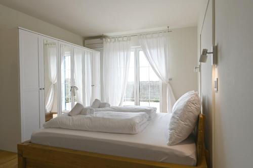 En eller flere senge i et værelse på Villa Maria