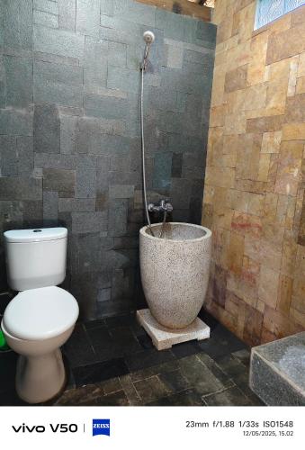 Ένα μπάνιο στο Villa Umah Kampung