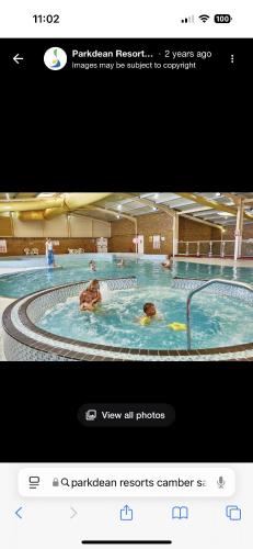a screenshot of a swimming pool with people in it at Roseanna in Kingsnorth