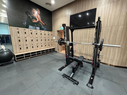 a room with a gym with a bench press at A La Carte Ha Long Bay Residence by SIMA Chill in Ha Long