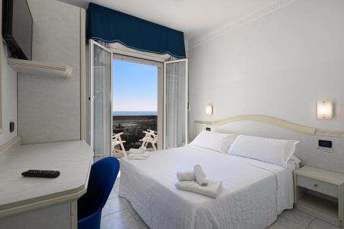 Postel nebo postele na pokoji v ubytování Hotel Oriente