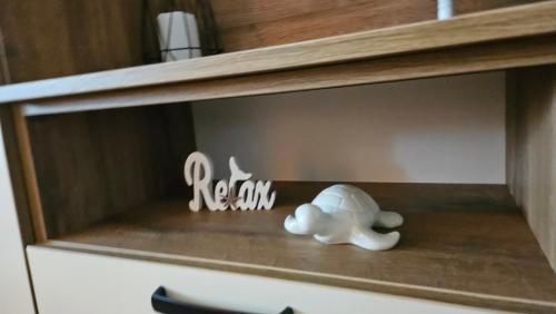 a toy elephant sitting on top of a shelf at VárLak in Várbalog