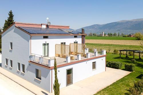 an image of a house with solar panels on the roof at Agriturismo La Semente in Spello