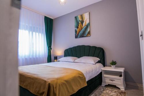 Ένα ή περισσότερα κρεβάτια σε δωμάτιο στο Apartament Domus Regis