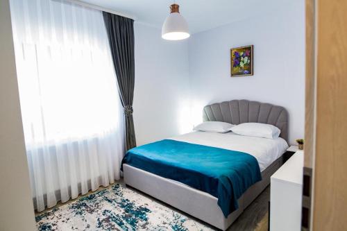 Ένα ή περισσότερα κρεβάτια σε δωμάτιο στο Apartament Domus Regis