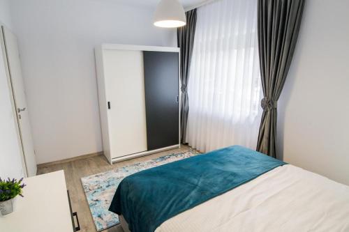 Ένα ή περισσότερα κρεβάτια σε δωμάτιο στο Apartament Domus Regis