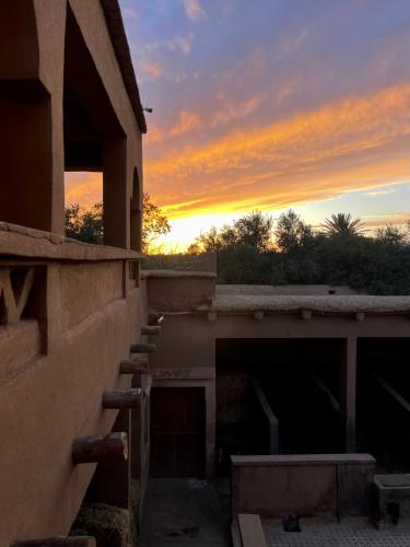 a sunset view from the roof of a building at Ranch Skouraya in Tajante
