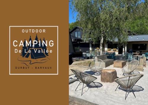 a couple of chairs sitting in a yard at Crossover lodge de la vallée in Durbuy