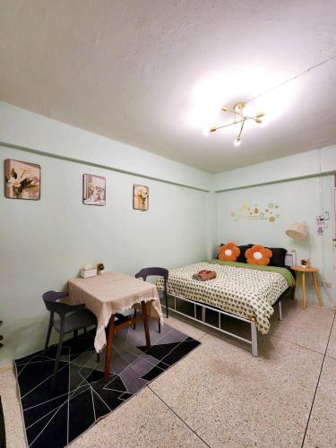 a bedroom with a bed and a table in it at 804-STP Homely room Free Wi-Fi and Near BTS line in Bangkok
