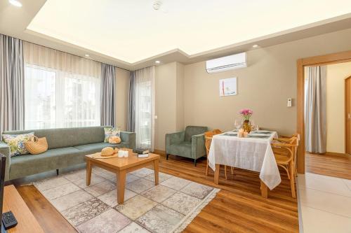 a living room with a couch and a table at The Suites in Antalya