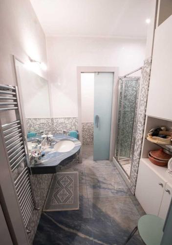 a bathroom with a sink and a mirror at Da Simo in Siena
