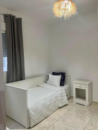 Ένα ή περισσότερα κρεβάτια σε δωμάτιο στο Appartement, en bord de mer