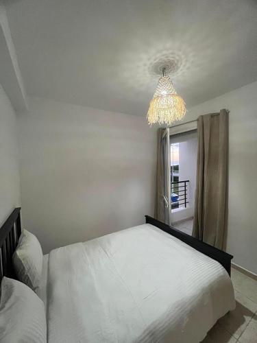 Ένα ή περισσότερα κρεβάτια σε δωμάτιο στο Appartement, en bord de mer
