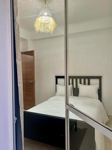 Ένα ή περισσότερα κρεβάτια σε δωμάτιο στο Appartement, en bord de mer