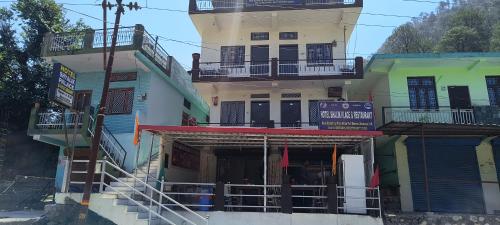 a group of buildings with stairs leading up to them at Hotel Shyalik Palace in Uttarkāshi