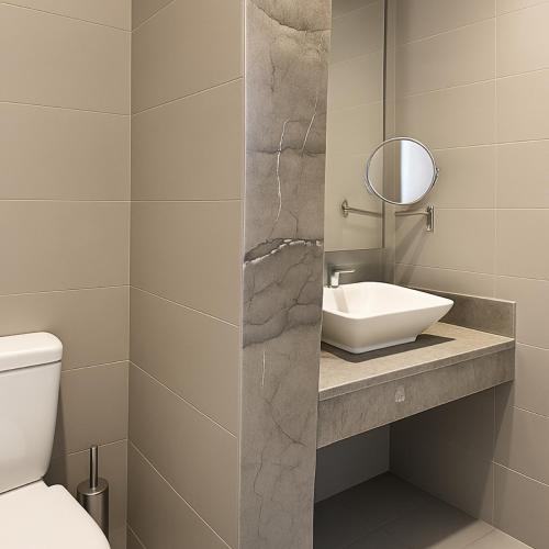 a bathroom with a sink and a mirror at Pickalbatros Palais Des Roses - Agadir - All Inclusive in Agadir