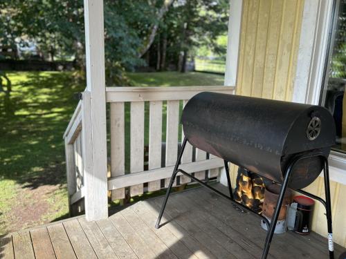 a grill on the porch of a house at Villa Älghult in Älghult