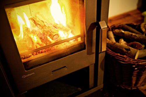 an open oven with food cooking in it at Ferienhausquartier Huberhof in Seehausen