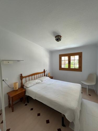 En eller flere senge i et værelse på Vistas de Cabomar