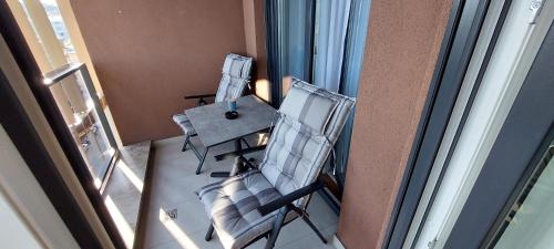 an overhead view of a balcony with chairs and a table at Extra Apartman in Banja Luka
