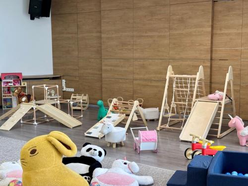 a room with many different types of play equipment at CE Plaza Hotel in Siófok