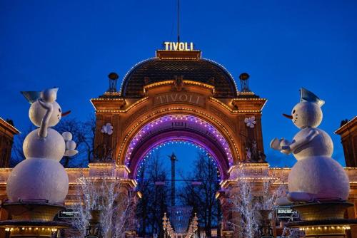 a large building with snowmen in front of it at Prime Location - Near Nyhavn & Tivoli Gardens in Copenhagen