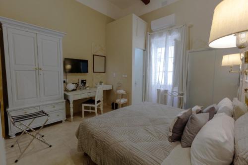Ένα ή περισσότερα κρεβάτια σε δωμάτιο στο Casa Ricca