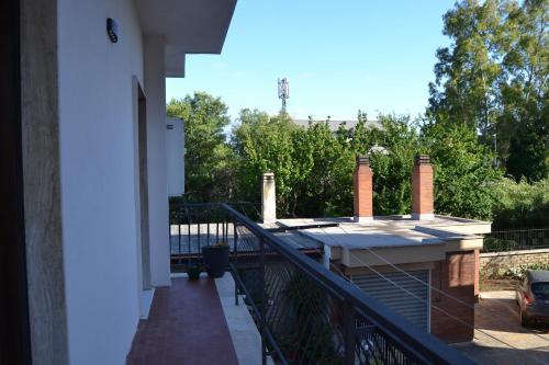 a balcony of a house with a railing at Casa Rolland in Acilia