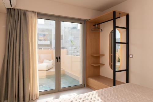 Ένα ή περισσότερα κρεβάτια σε δωμάτιο στο Nympheas Luxury Villas