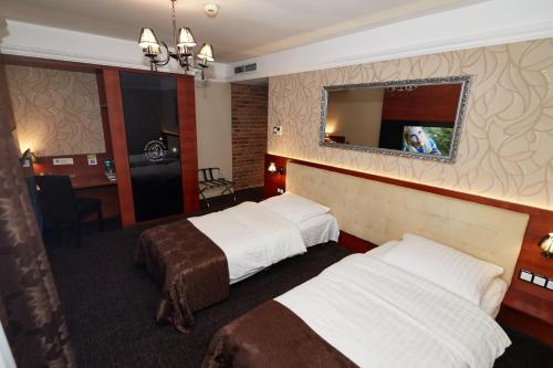 Hotel&Spa Kameleonにあるベッド