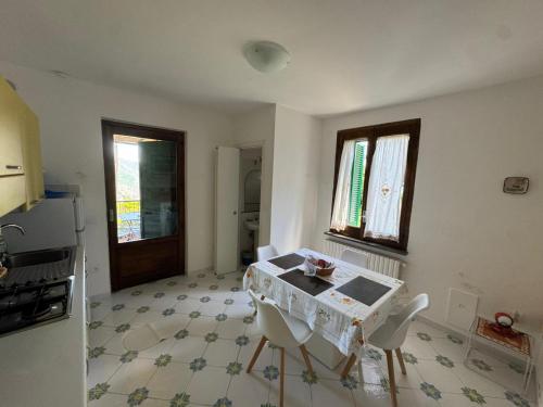 a kitchen with a table and chairs in a room at Villa Casale Ravello Residence in Ravello
