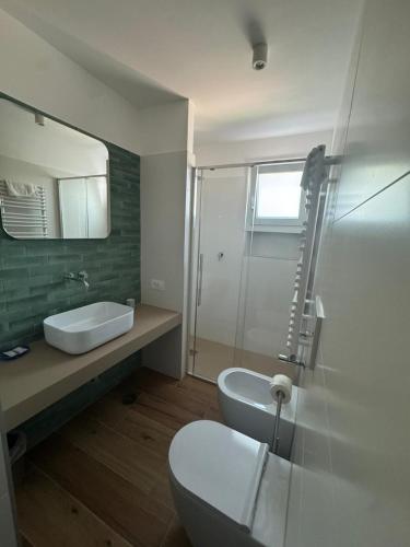 a bathroom with a toilet and a sink and a shower at Villa Casale Ravello Residence in Ravello