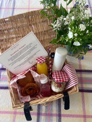 a picnic basket with food and a piece of paper at The Red Lion in Blewbury
