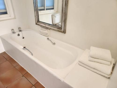 Un baño de At Let se Plek