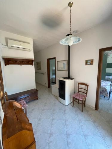 a living room with a couch and a table and chairs at Country House la Quercia in Mogliano Veneto
