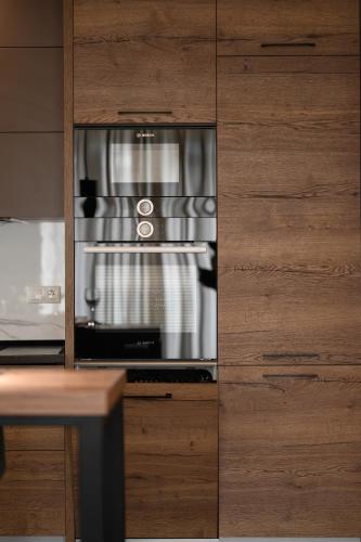 a kitchen with a toaster oven in a cabinet at Luxury Apartments Babyak in Uzhhorod
